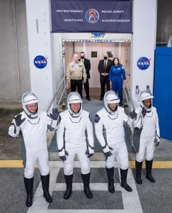 Roscosmos cosmonaut Alexander Grebenkin, left, NASA astronauts Michael Barratt, second from left, Matthew Dominick, second from right, and Jeanette Epps, right, wearing SpaceX spacesuits, are seen as they prepare to depart the Neil A. Armstrong Operations and Checkout Building for Launch Complex 39A to board the SpaceX Dragon spacecraft for the Crew-8 mission launch, Sunday, March 3, 2024, at NASA’s Kennedy Space Center in Florida. NASA’s SpaceX Crew-8 mission is the eighth crew rotation mission Photo Credit : NASA / SpaceX